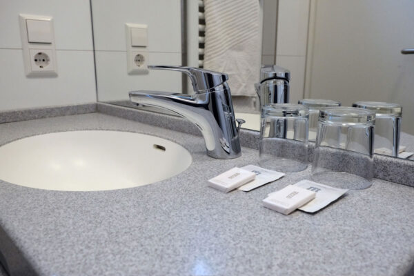 Washbasin with Care Products – Hotel Room in Stuttgart City Center